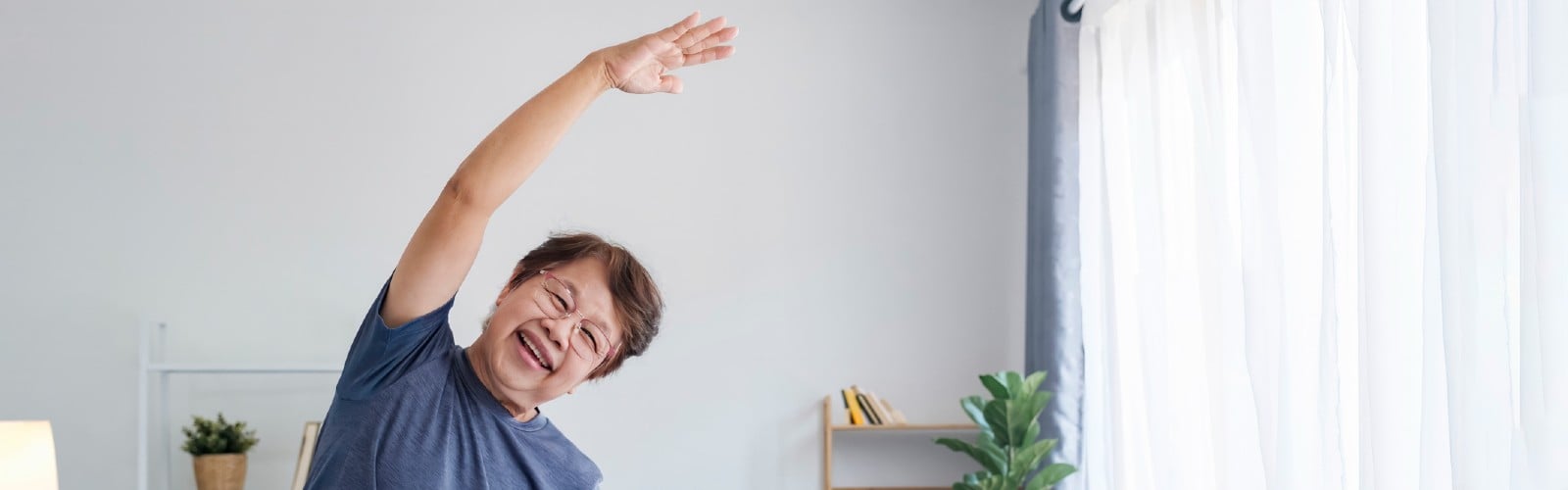 A woman stretching in her living room