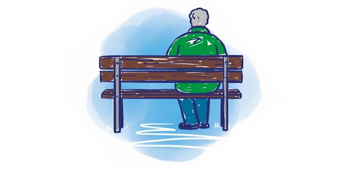 Lonely older person on park bench