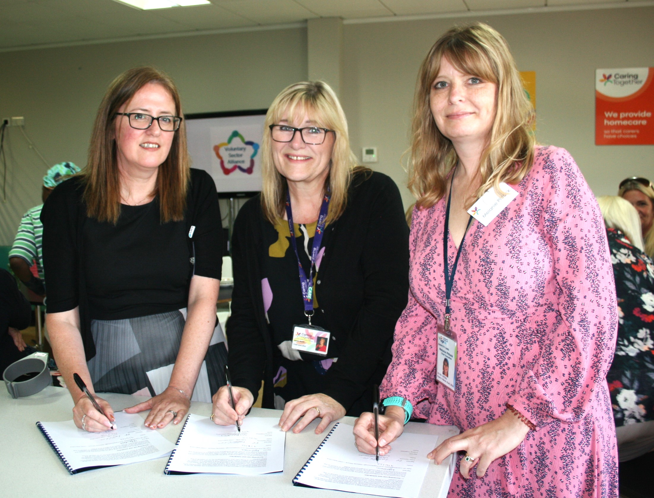 Group photo of MOU signing - Lynette Hurren – Voluntary Sector Alliance programme director, Care Network Cambridgeshire, Miriam Martin - Chief Executive, Caring Together, Melanie Pittock - Chief Executive of Age UK Cambridgeshire & Peterborough