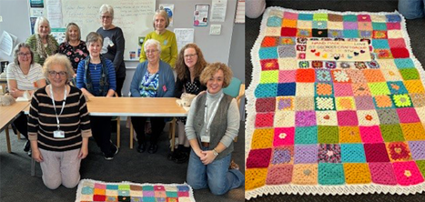 Coffee and Crafting Club members with their multi-coloured blanket