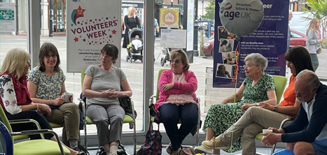 A group of people discussing volunteering in Age UK Shropshire Telford &amp; Wrekin's Shrewsbury office