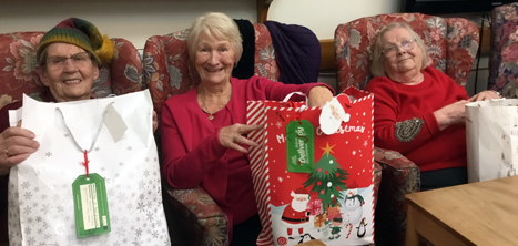 Greenacres day centre members receiving their Christmas gifts