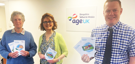 Age UK Shropshire Telford & Wrekin’s Benefits team holding information guides