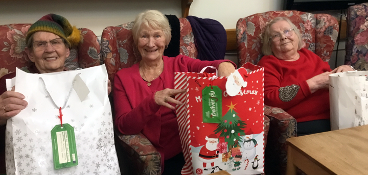 Greenacres day centre members receiving their Christmas gifts