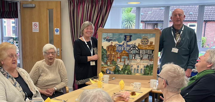 Newport day centre volunteers and members with the tile mural