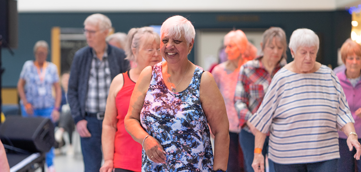 Older people line dancing