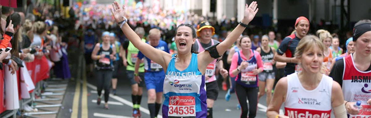 Runner waving to crowd