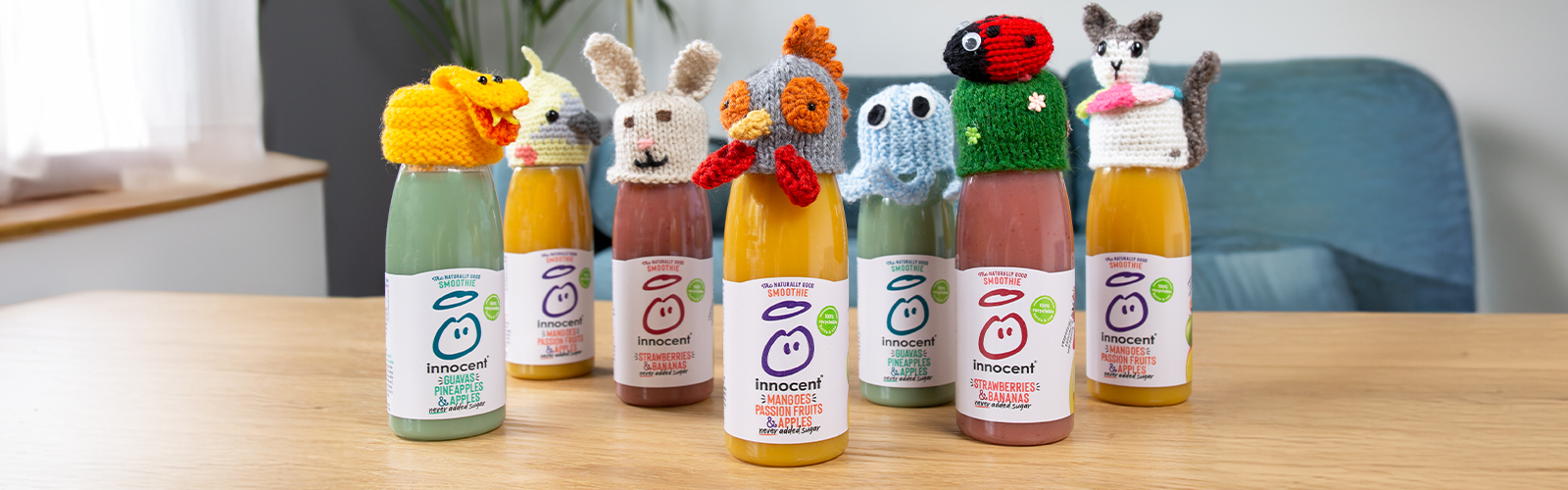 A line of innocent smoothies wearing little woolly hats