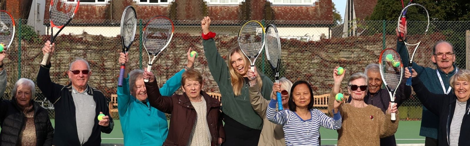 Tennis player Katie Boulter smiling on a recent visit to Age UK Sutton's walking tennis session