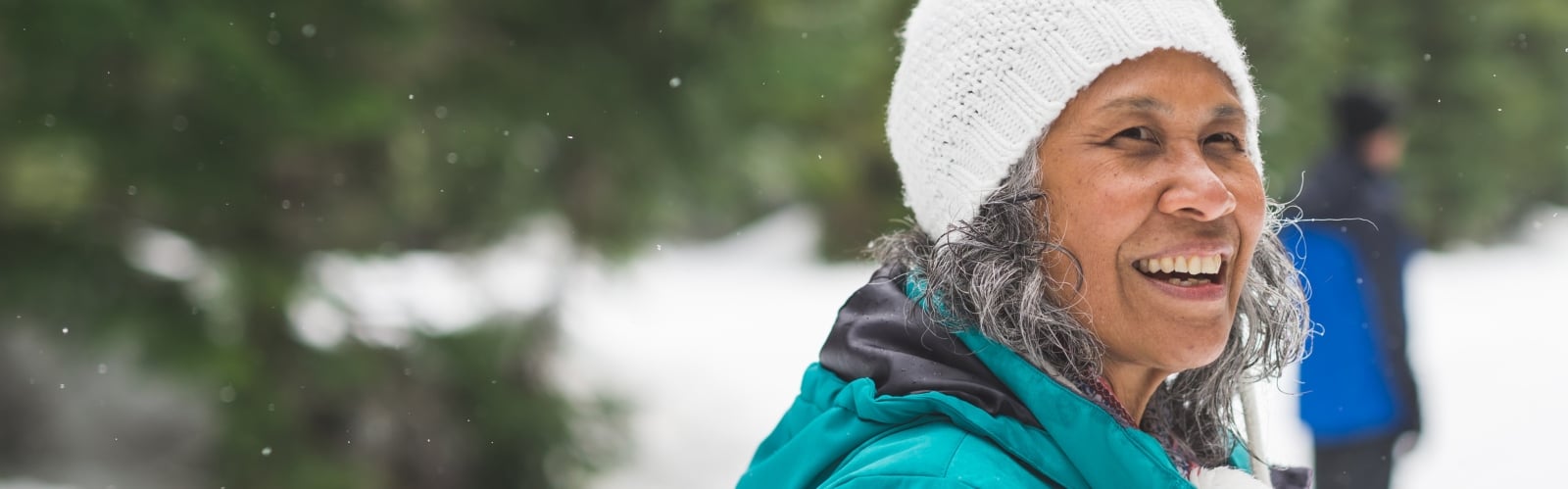 An older woman out and about in the snow