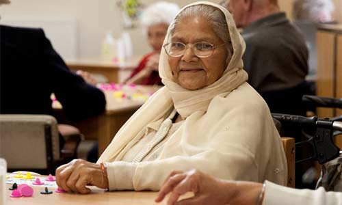 An older Asian woman at a day centre