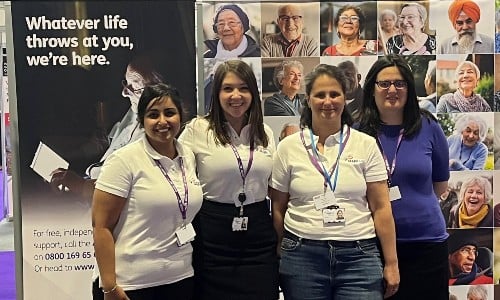 Four members of Age UK staff standing together