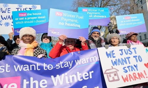 A group of older people with placards, protesting the Winter Fuel Payment changes