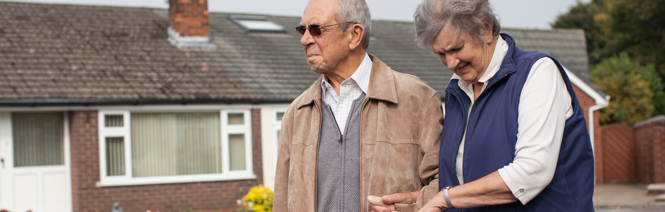 A man waiting for hospital transport with his wife