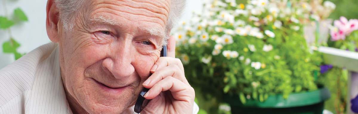 Older man on phone 1200x383.jpg